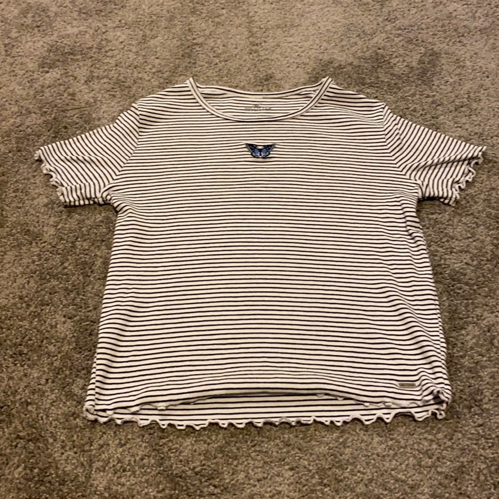 Hollister black and white striped top with a blue butterfly.